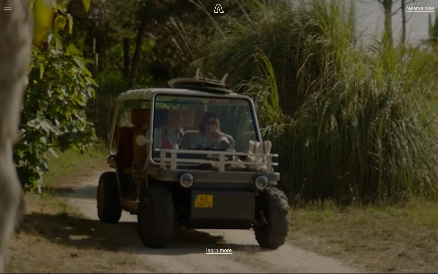 Amble’s homepage: the Amble One driving down a sandy, tree-lined track